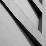 Black and white abstract architectural photo highlighting geometry and lines.